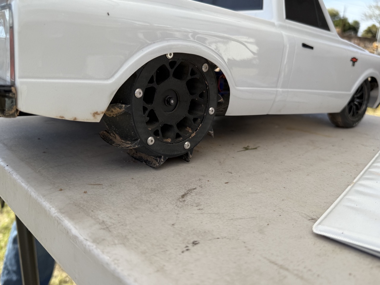 RC car on sand fitted with AKRC tires